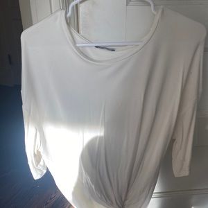 White shirt with knot.